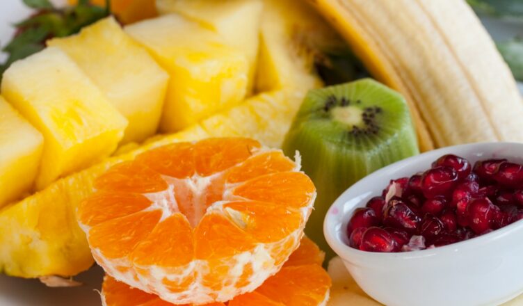 sliced orange fruit on white ceramic bowl