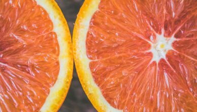 Detailed close-up of fresh grapefruit slices showcasing vibrant colors and textures.