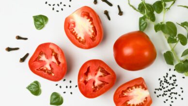 red tomato on white surface