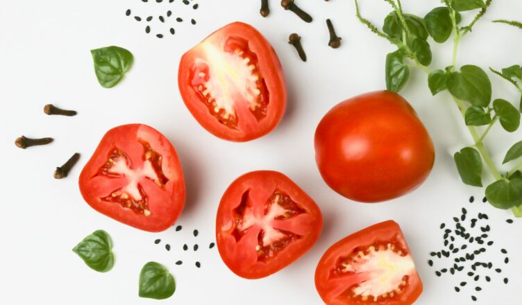 red tomato on white surface